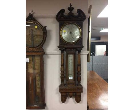 A late Victorian oak aneroid barometer by F. Robson