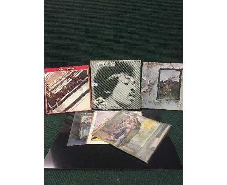 A collection of LP's and singles to include; Jimi Hendrix Anniversary Box Set, Jethro Tull, David Bowie, Meatloaf, Black Sabb