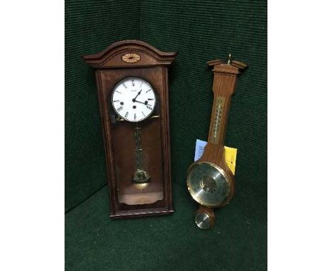 A contemporary inlaid mahogany Westminster chime wall clock and a banjo barometer 