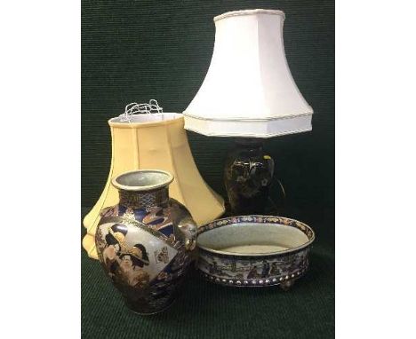 A decorative china table lamp with shade together with two extra shades and Japanese style vase with planter