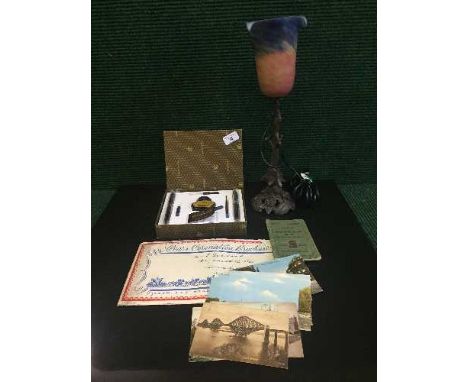A tin of early twentieth century postcards, together with an ornate lamp with glass shade and Nazareno Gabrielli pen set.