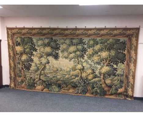 A good quality tapestry wall hanging depicting a forest glade, width 397cm 