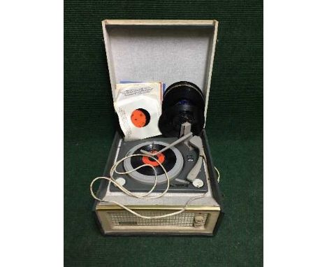 A mid 20th century Dansette Monarch table top record player and a small quantity of 45's and 78's