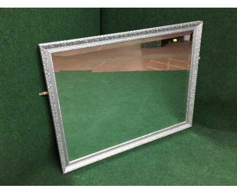 A silvered framed over mantel mirror 