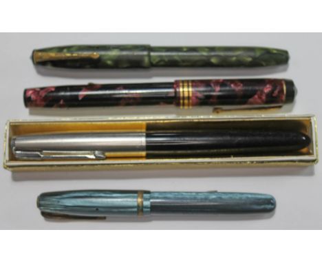 A group of three vintage fountain pens with 14ct gold nibs and a Parker.  