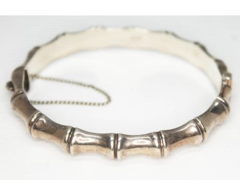 A hallmarked silver bamboo effect bangle, diam. approx. 5.8cm, wt. 14.25g.  