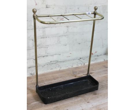 A late Victorian brass stick and umbrella stand with cast iron base, height 57cm.  