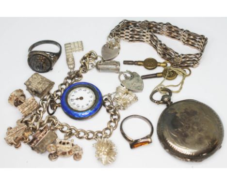A mixed lot of silver comprising a hallmarked silver charm bracelet, a hallmarked silver ring and a ring marked '925', a hall