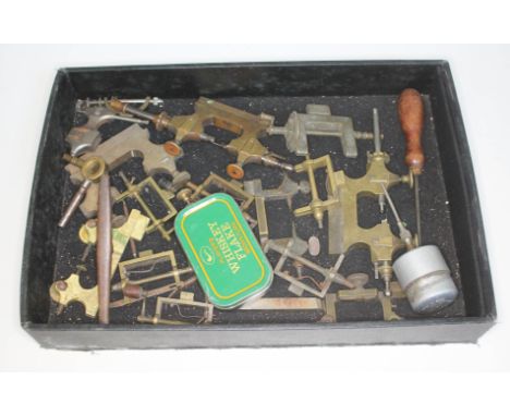 A tray containing a quantity of watch making tools.  