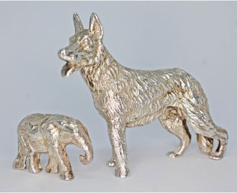 A novelty silver model dog, Mappin &amp; Webb, London 1973, length 6cm, together with a model elephant, SMD Castings, London 