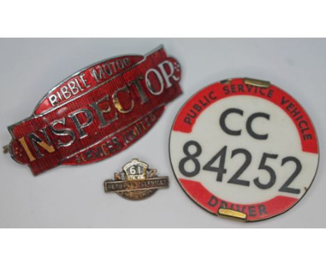 Transport badges comprising an enamel 'Ribble Motor Inspector Services Limited' cap badge, a plastic 'Public Service Vehicle'