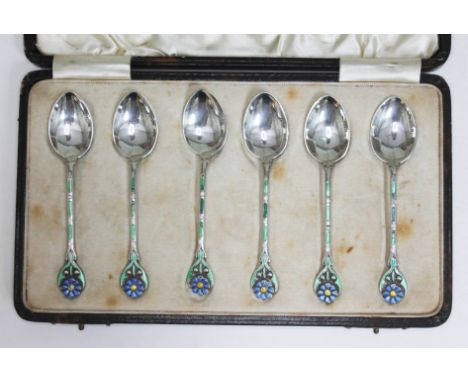 A cased set of six Art Deco silver and enamel teaspoons with flower head finials, Turner &amp; Simpson, Birmingham 1929.  