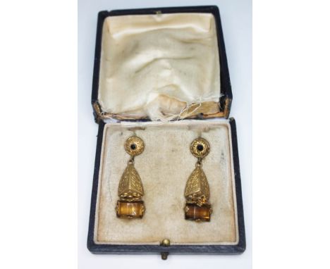 A pair of vintage yellow metal drop earrings set with orange paste, length 38mm, with box (damaged at hinge).  