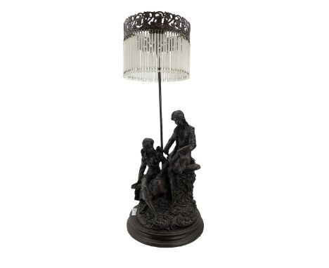 Bronzed resin table lamp with two figures and tasselled shade H75cm