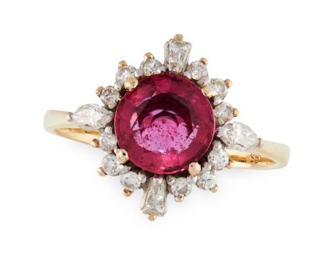 A RUBY AND DIAMOND CLUSTER RING in yellow gold, set with a round cut ruby of 0.75 carats in a border of round, marquise and t