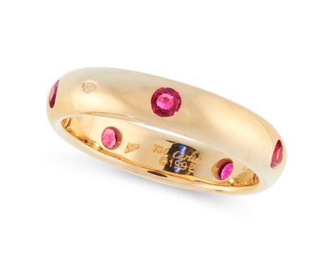 A RUBY BAND RING, CARTIER in 18ct yellow gold, set with five round cut rubies, signed Cartier, stamped 750, size J / 5, 4.6g.