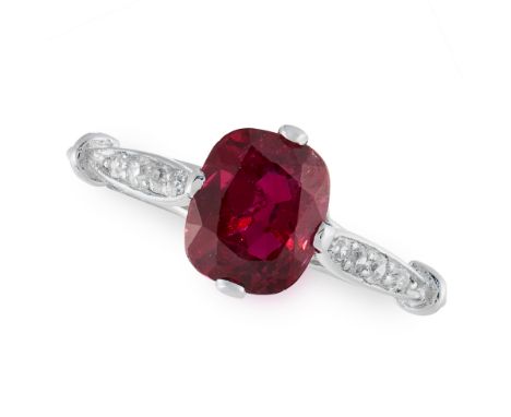 AN UNHEATED RUBY AND DIAMOND RING set with a cushion cut ruby of 1.61 carats with round cut diamonds to the shank, Swedish as