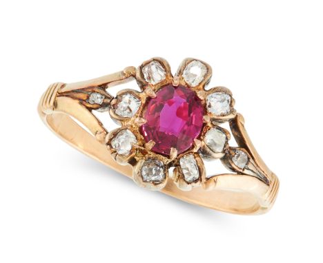 AN ANTIQUE RUBY AND DIAMOND CLUSTER RING in yellow gold, set with a cushion cut ruby in a border of old cut diamonds, unmarke