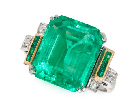 A COLOMBIAN EMERALD AND DIAMOND RING in 18ct white gold, set with an emerald cut emerald of 9.00 carats between stepped shoul