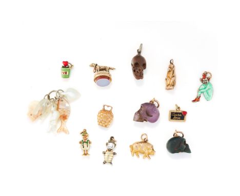 A MIXED LOT OF CHARMS comprising of carved hard stone skulls, assorted carved shell charms, five enamel charms and assorted a