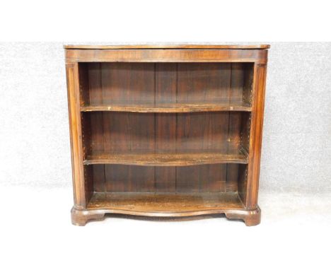 A Victorian rosewood serpentine fronted open bookcase on shaped bracket feet. H.89 W.96 D.29cm