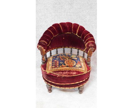 A Victorian tapestry upholstered mahogany framed tub armchair with revolving action. H.73cm 