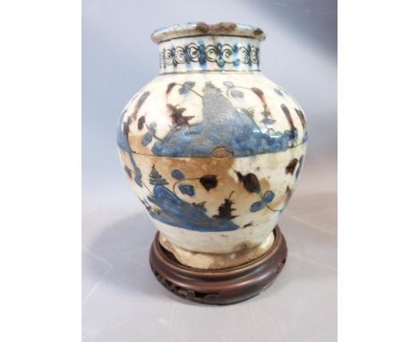 A middle eastern ceramic glazed vase on carved wooden Chinese stand. H23cm. 