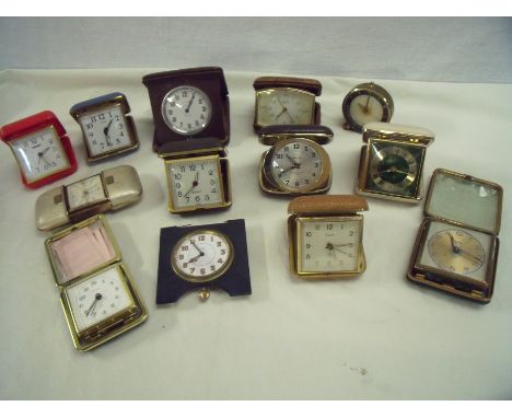 Large selection of compact and travelling clocks including Vertex 8 day, a 8 day alarm clock, crocodile skin case Swiza Coral