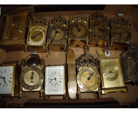 Box of various reproduction miniature brass lantern style clocks, carriage style clocks and 1920s style compact travelling cl