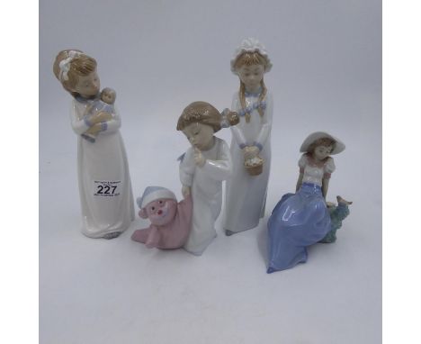 Four Nao figurines to include a sleeping girl tallest H: 30 cm. Not available for in-house P&amp;P 
