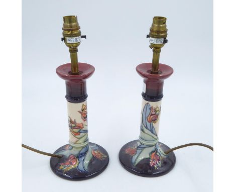 Pair of Moorcroft candlestick form lamps, no cracks or chips, H: 30 cm. All electrical items in this lot have been PAT tested