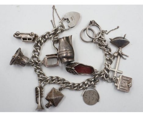 Sterling silver charm bracelet with thirteen charms, L: 18 cm, 50g. UK P&amp;P Group 0 (£6+VAT for the first lot and £1+VAT f