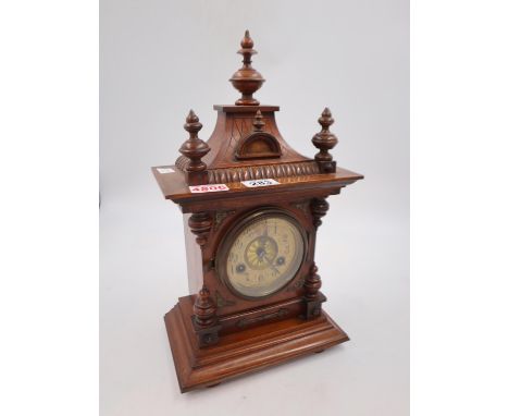 Mahogany cased mantel clock of architectural form, key and pendulum present, H: 43 cm. Not available for in-house P&amp;P