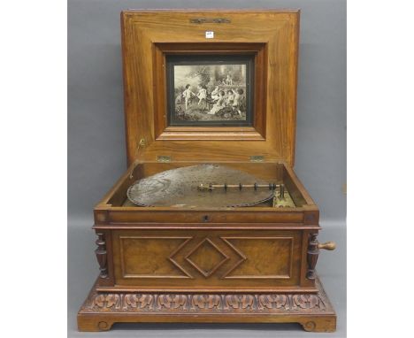   Spieluhr  geschnitzter Holzkasten, Polyphon, um 1880, eine Metallplatte, d 40 cm, läuft an, h 35 cm, b 55 cm, t 50 cm,     
