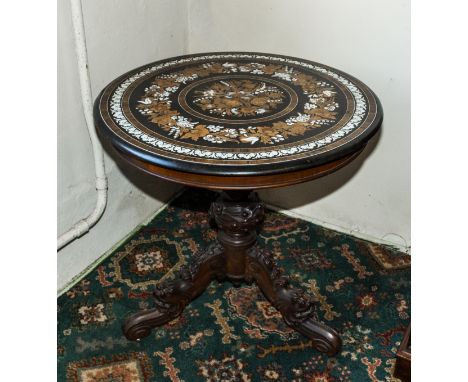 An early 19th century Florentine rosewood, ivory and mother of pearl marquetry inlaid table top on a carved walnut column wit