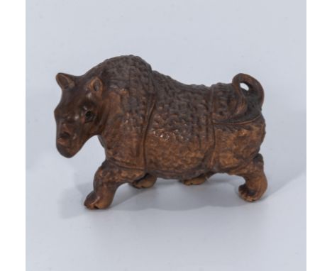 A hardwood carving of a Sumatran rhino netsuke