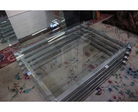 A chrome and glass rectangular coffee table, possibly French, 1970s, 40cm high, 120cm wide, 90cm deep; and matching firescree