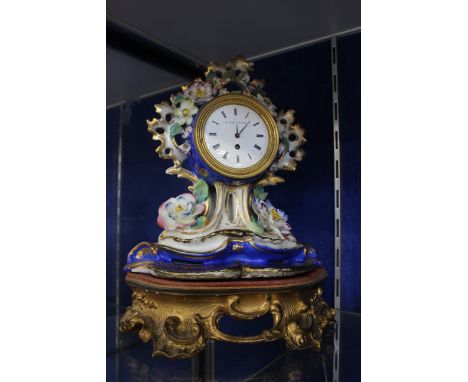 A Gudin A Paris porcelain mantel clock on stand, 30cm high