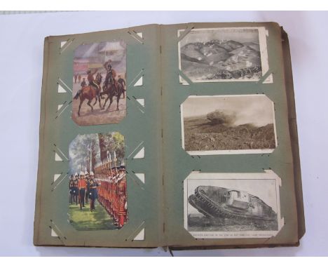 AN EARLY 20TH CENTURY ALBUM of military postcards to include the The King at the Front, Army Gymnastics Royal Engineers, Guar