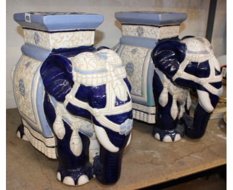 A pair of ceramic elephants stools