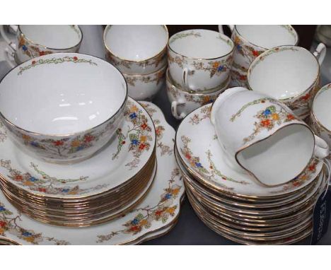 EARLY 20TH CENTURY TEA SET
stamped Standard China, with enamelled foliate design, twelve cups, eleven saucers and side plates