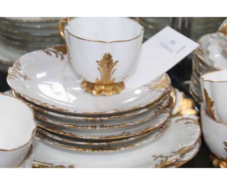 EARLY 20TH CENTURY LIMOGES TEA SET
in attractive gilt scollaped pattern, with eleven cups, twelve saucers, twelve side plates