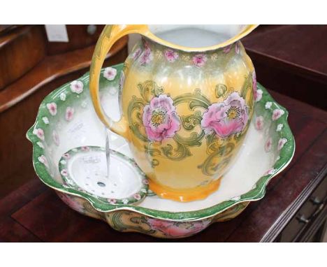 EDWARDIAN TRANSFER PRINTED WASH BASIN AND JUG
with floral decoration in pink, with green and yellow ground, as with a matchin