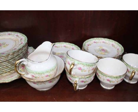 TUSCAN CHINA TEA SET
comprising twelve cups, twelve plates, eleven saucers, sugar and cream and a pair of biscuit plates