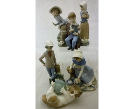 A collection of ten Lladro figurines of children and kittens