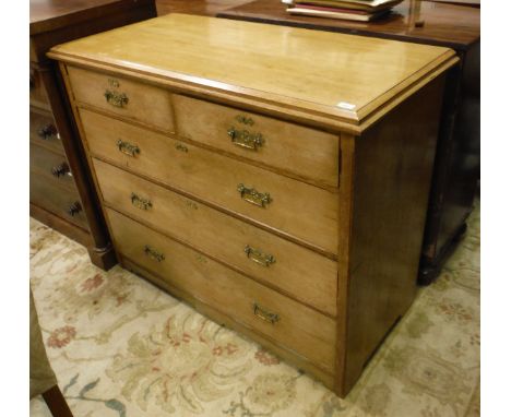 A Victorian golden oak chest, the shallow caddy top over two short and three long drawers with gothic style lacquered brass h