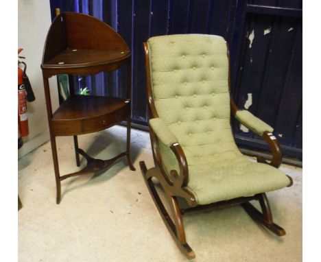 A Victorian mahogany rocking chair, the button back upholstered seat and back as one, with upholstered arms in green self pat