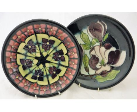 Two modern Moorcroft plates CONDITION REPORTS Crazing to both plates, there is a heavy scratch to the centre of the geometric