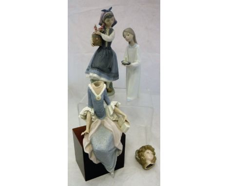 A collection of three Lladro figurines to include "Dutch girl with barrel of flowers" (3)