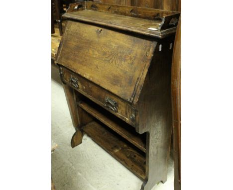 An oak student's bureau, together with an oak tripod table, the top of hexagonal form, a pair of cane seated bedroom chairs, 